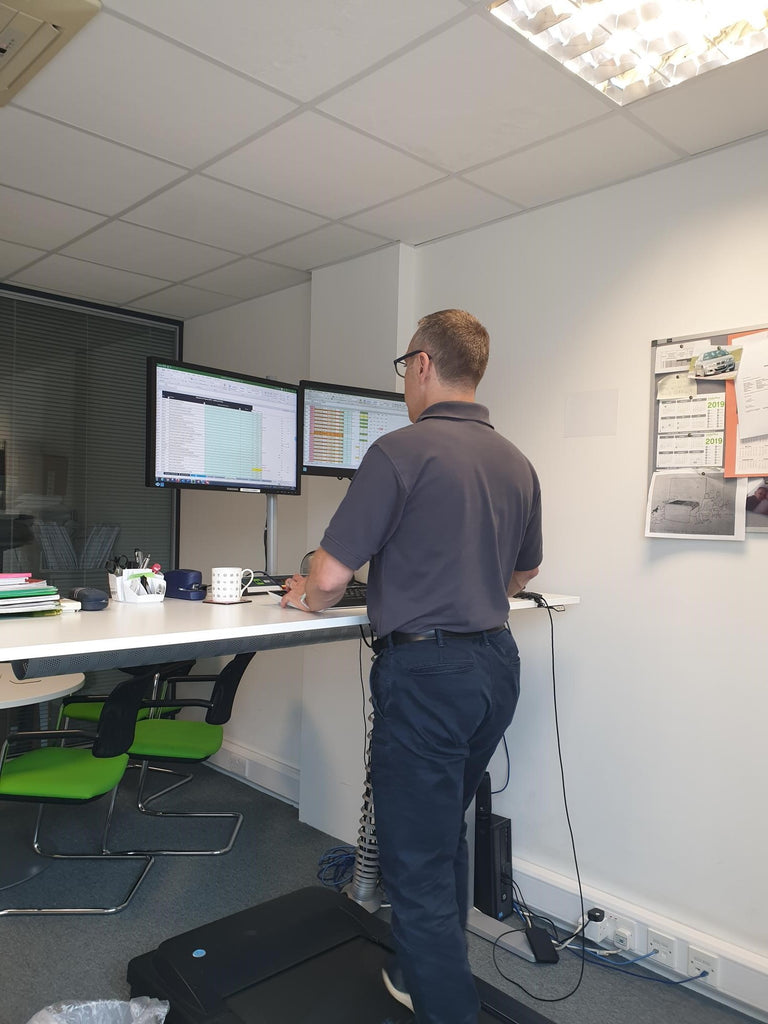 Person working at a treadmill desk